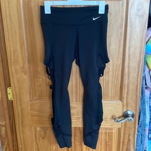 Nike leggings with criss cross designs on the side